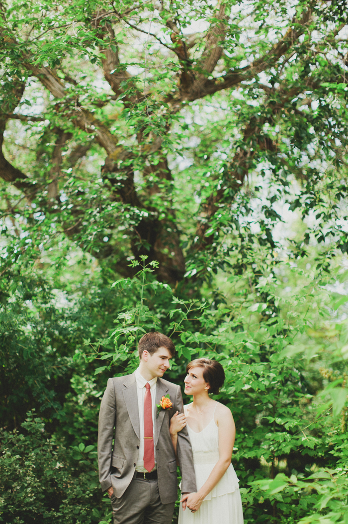 Bride and groom portraits in their garden before going to their church ceremony