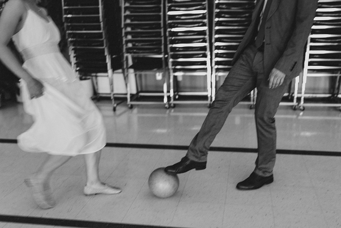 Couple playing kickball before their wedding ceremony