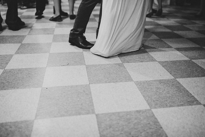 Bride and groom dancing with their guests at a community hall wedding