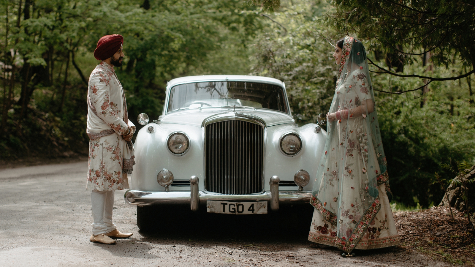 Sikh wedding couple posing in front of a vintage Rolls Royce in Hamilton, Ontario