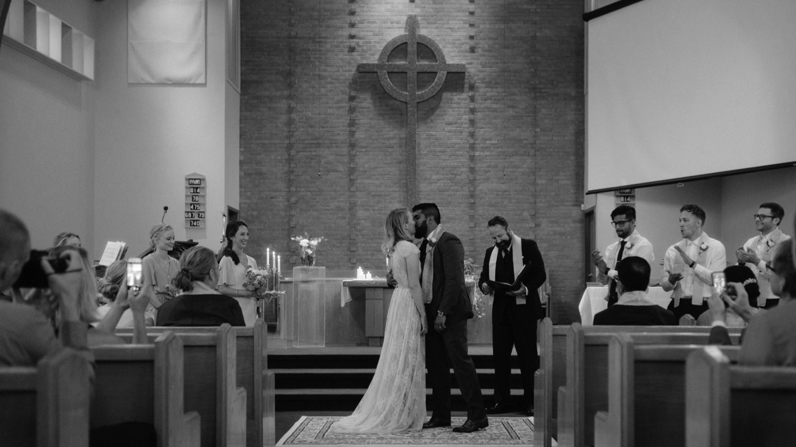 Intimate ceremony first kiss in Presbyterian church in calgary