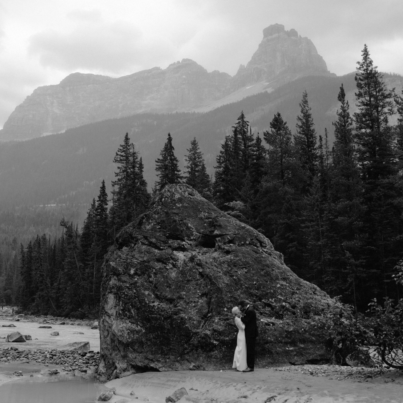 Unique ceremony location in Banff and Yoho parks in Canada with a large boulder altar, river and mountain backdrops