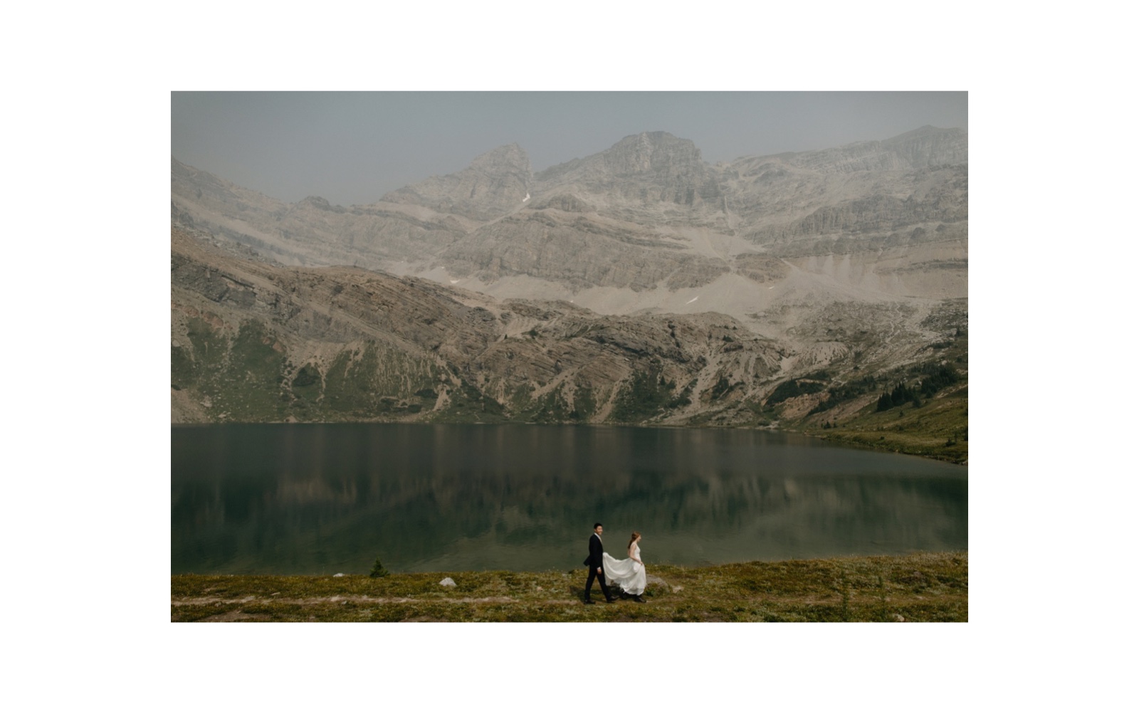 Wedding couple hiking along Hidden Lake after their adventurous wedding ceremony in Banff