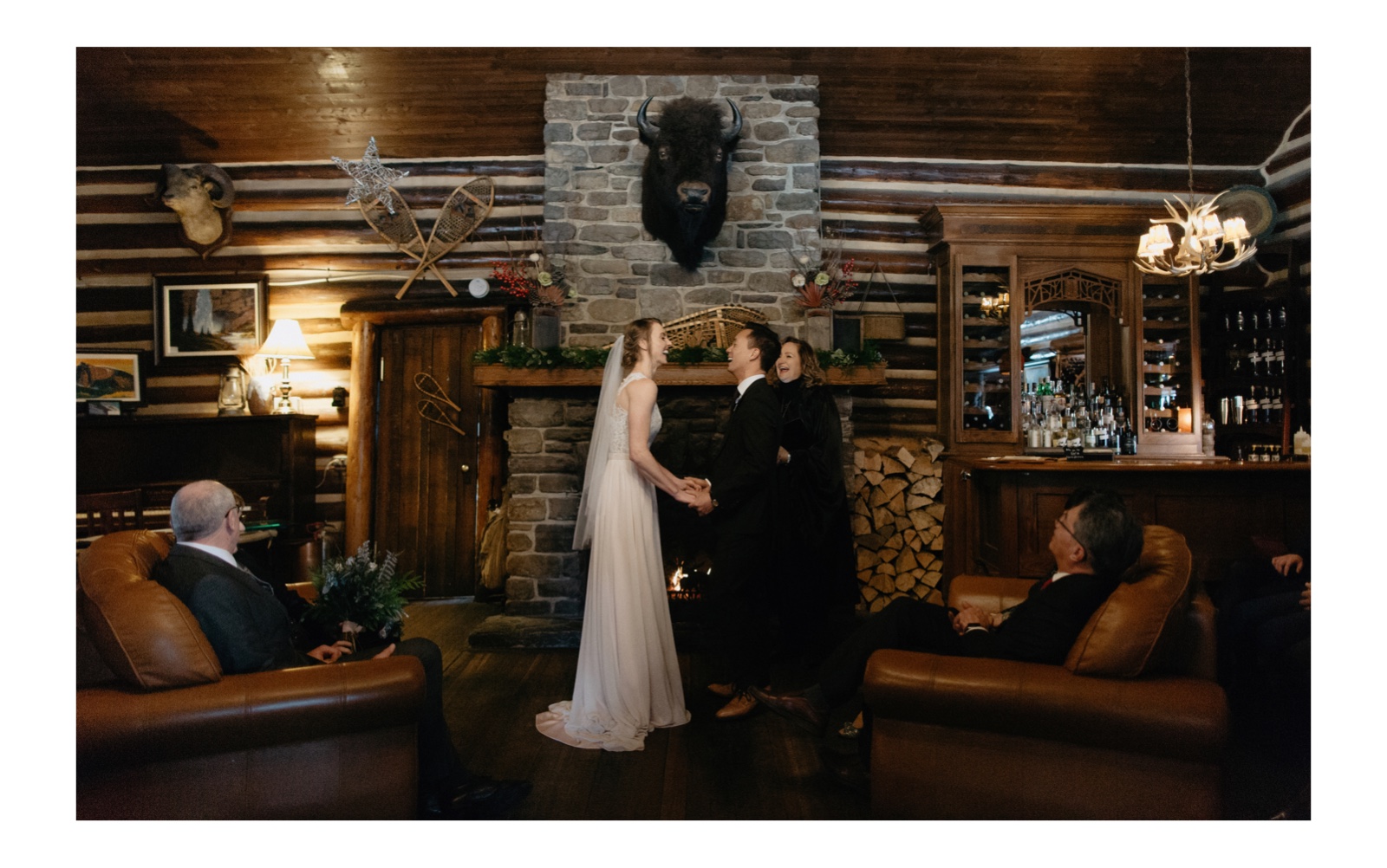 Fireplace ceremony location in historic Storm Mountain Lodge in Banff