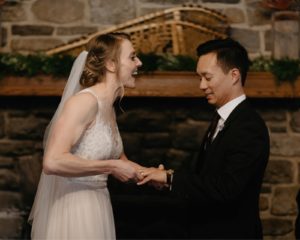 Storm Mountain Lodge wedding in front of the fireplace