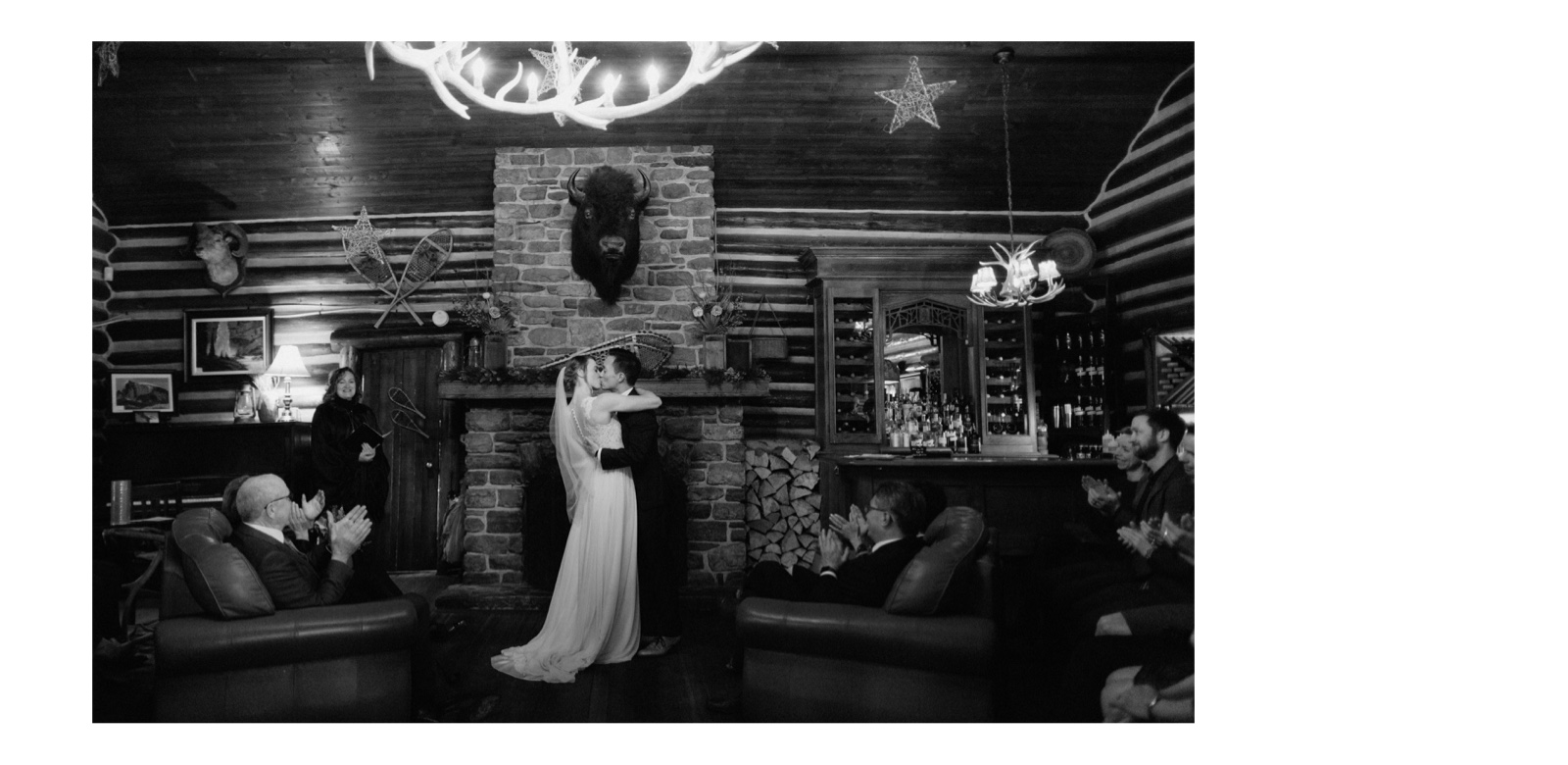 Fireplace ceremony first kiss at Storm Mountain Lodge in Banff