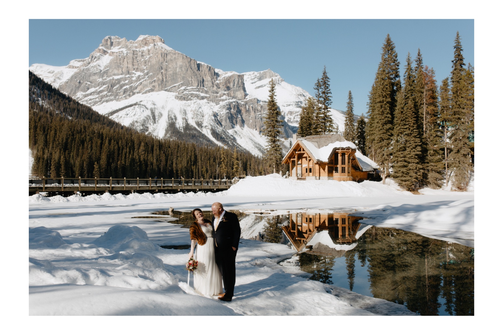 Wedding couple overlooking Cilantro at Emerald lake Lodge on a winter solstice day