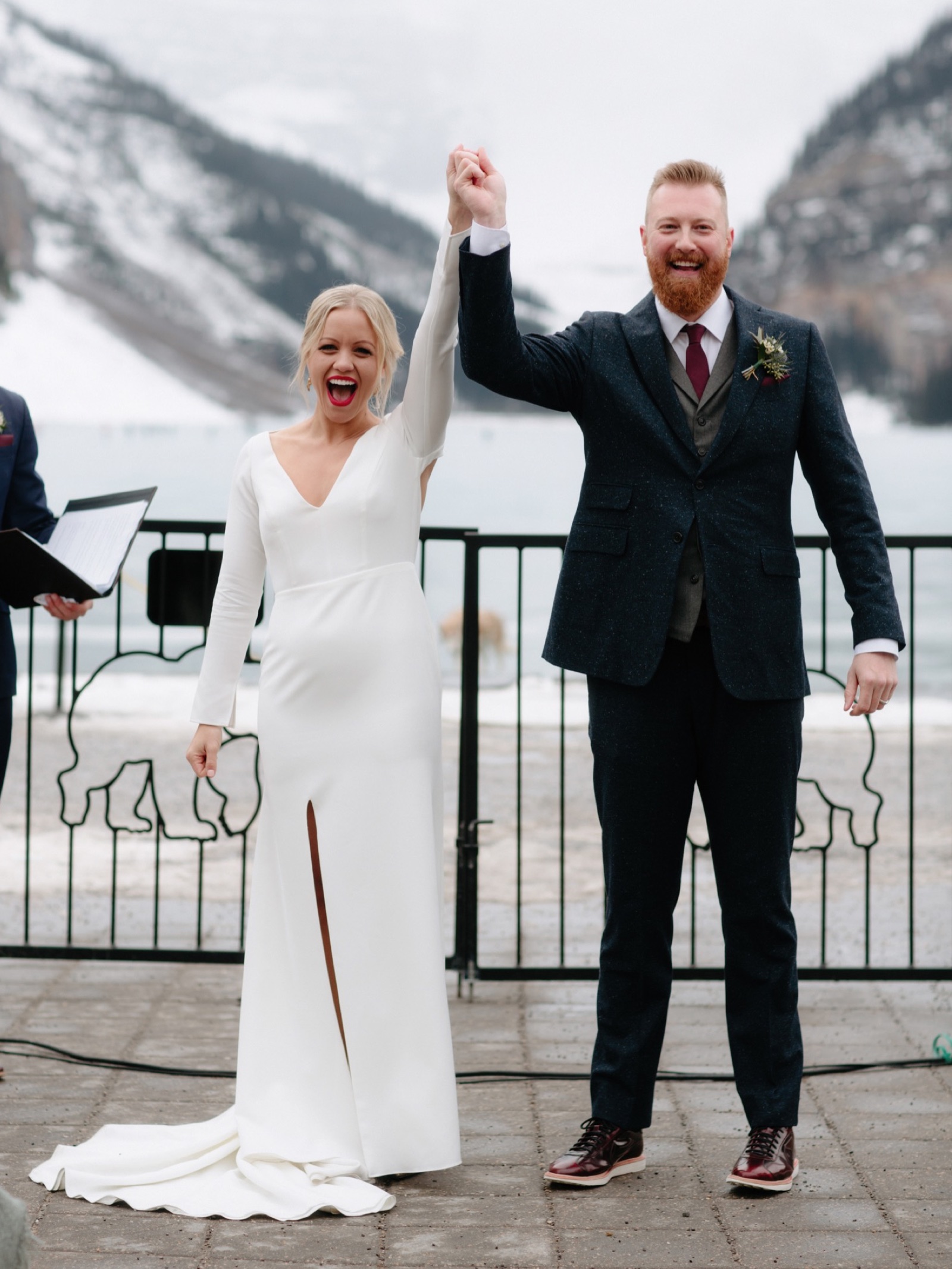 Couple celebrating being newly married on the Lakeside Terrace at the Chateau Lake Louise