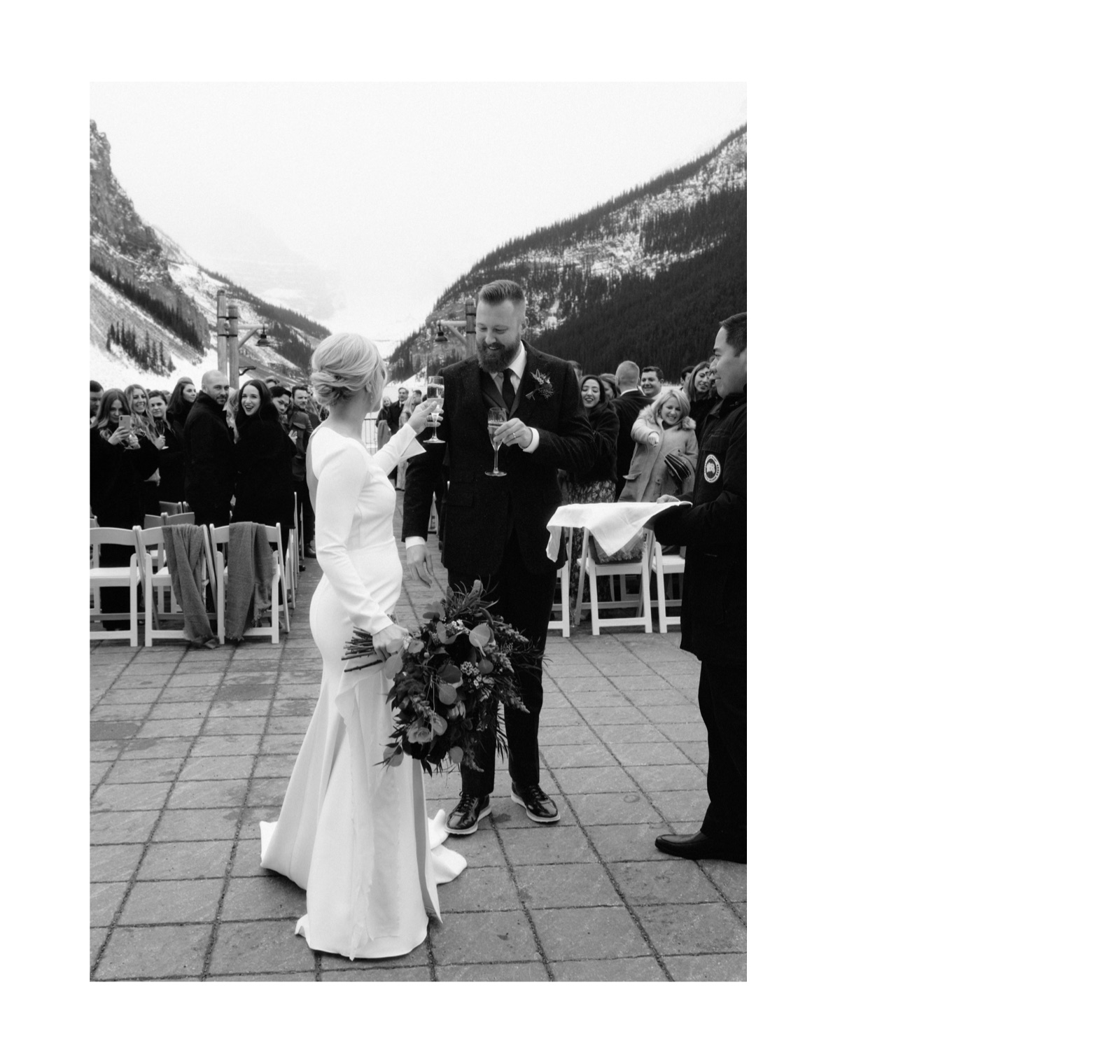 Champagne toast with a couple immediately following their winter ceremony on the outdoor terrace in lake Louise