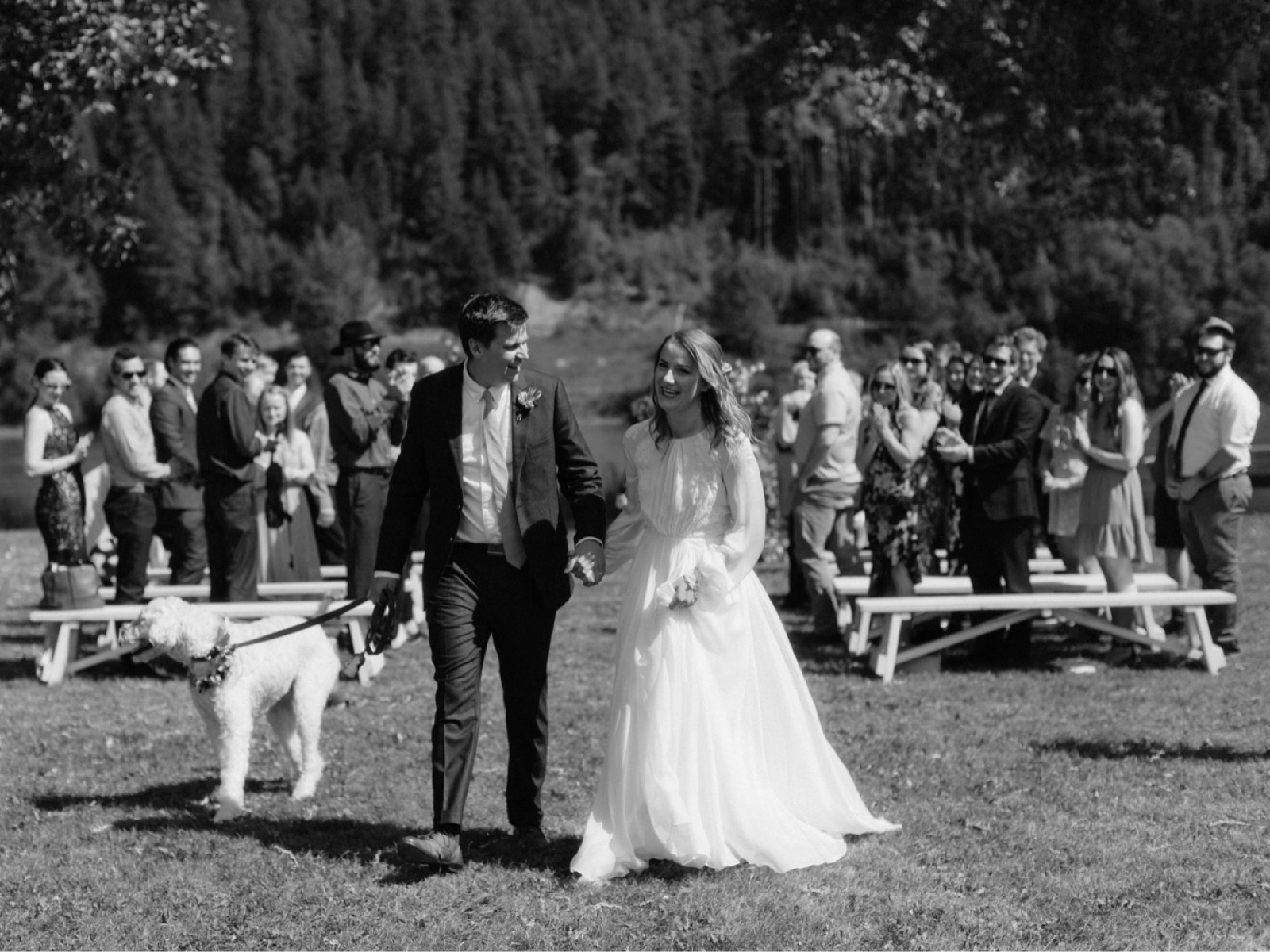 Newly married couple with their dog following their parkside wedding ceremony near their home in Prince George