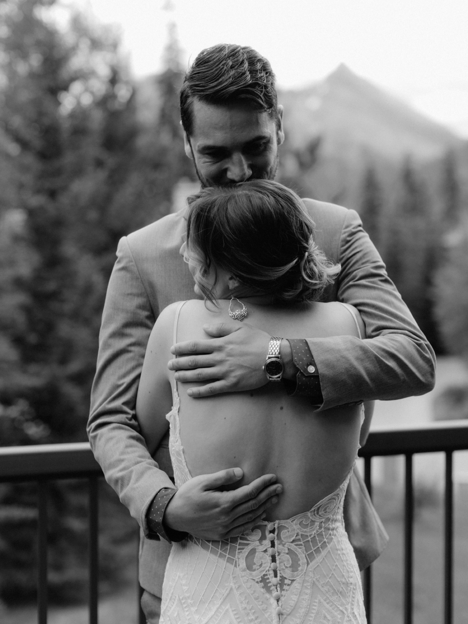 A wedding couple's first look in Silvertip, Canmore overlooking the Three Sisters Mountain Range