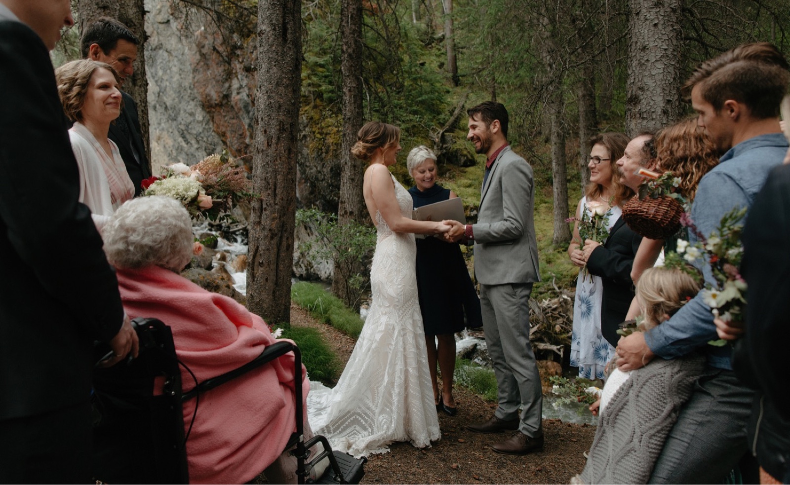 Intimate standing wedding ceremony in a secluded canyon in Banff National Park