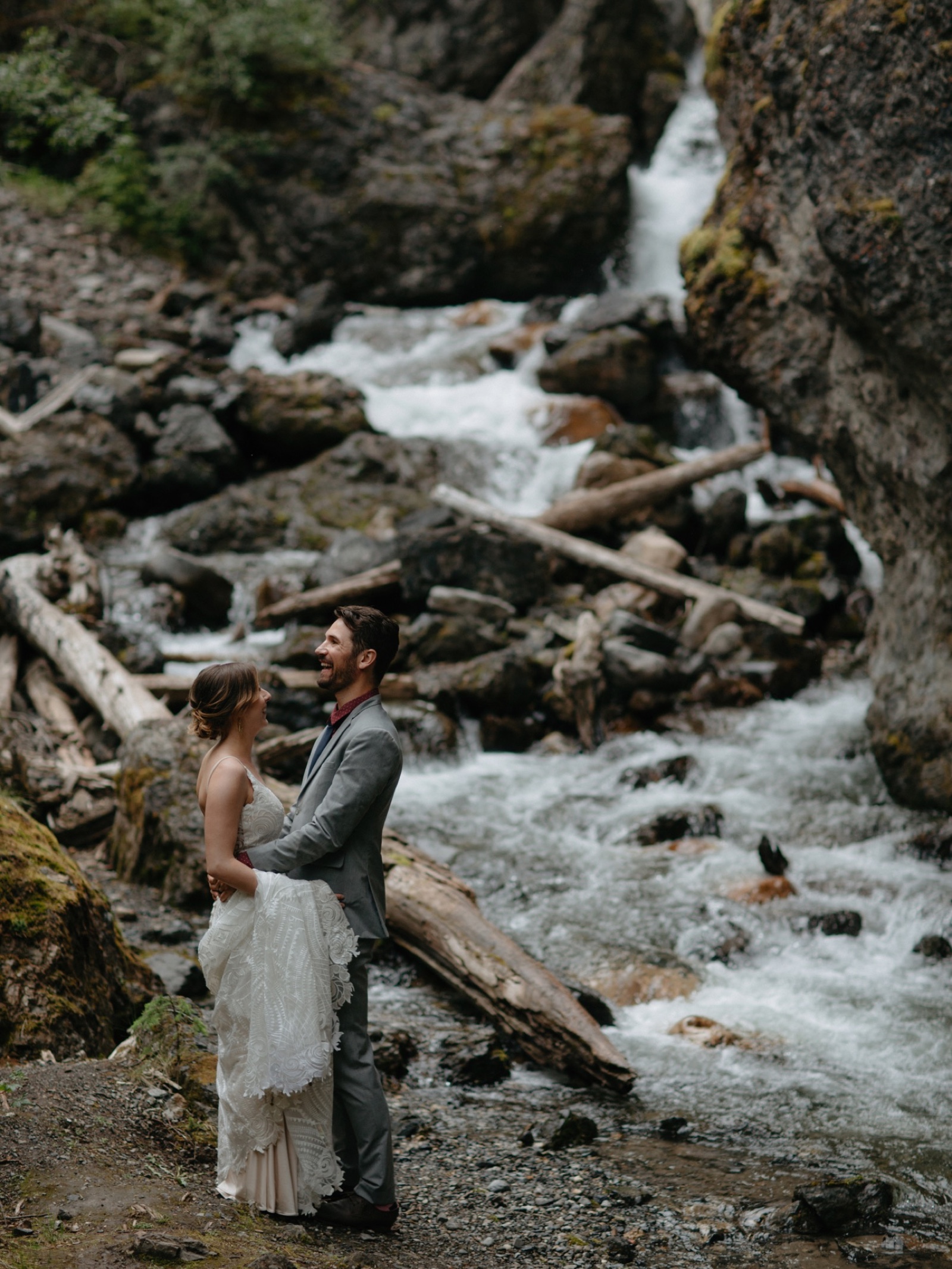 Waterfall backdrop in a canyon for this Banff wedding couple