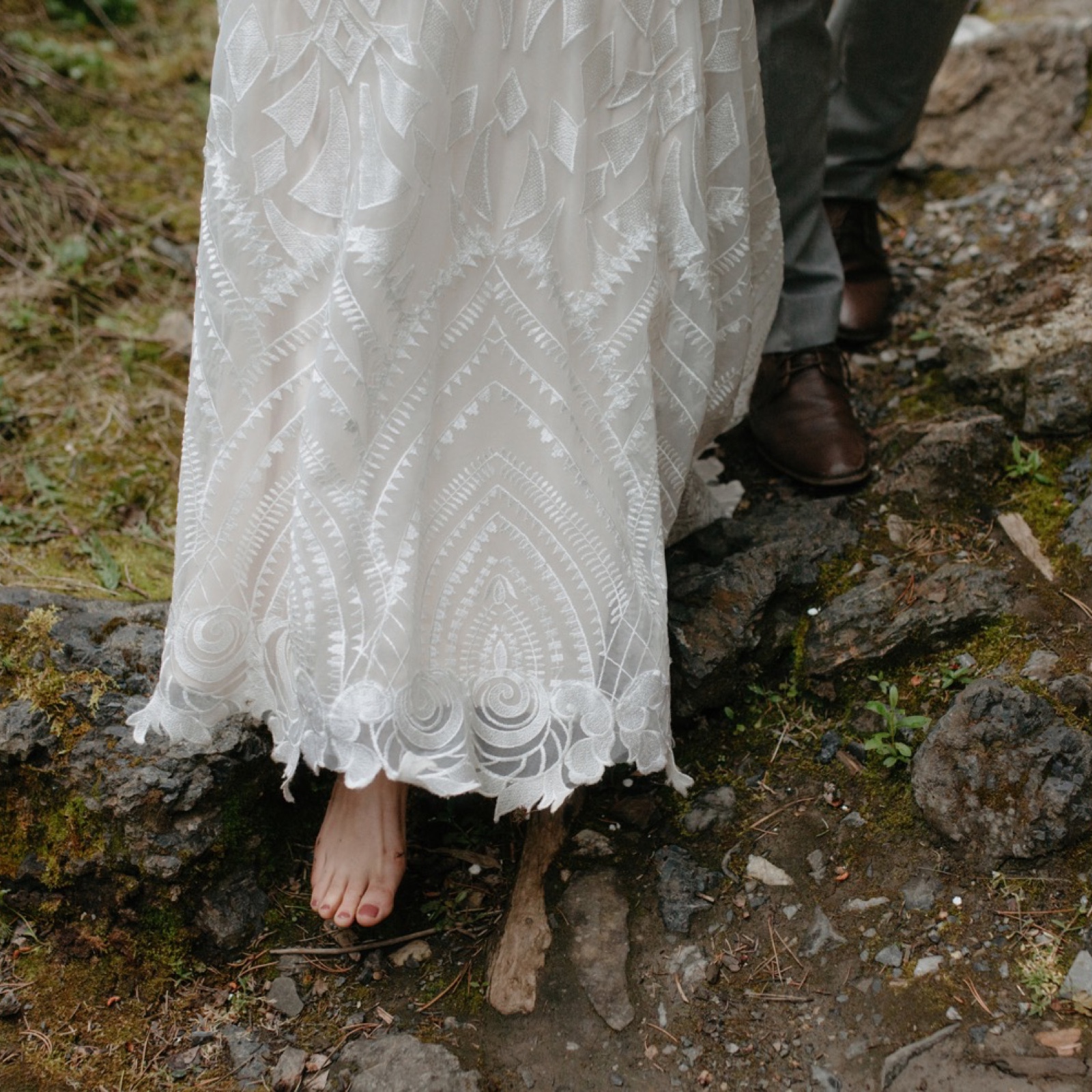 Barefoot bride wearing a geometric patterned dress in Banff