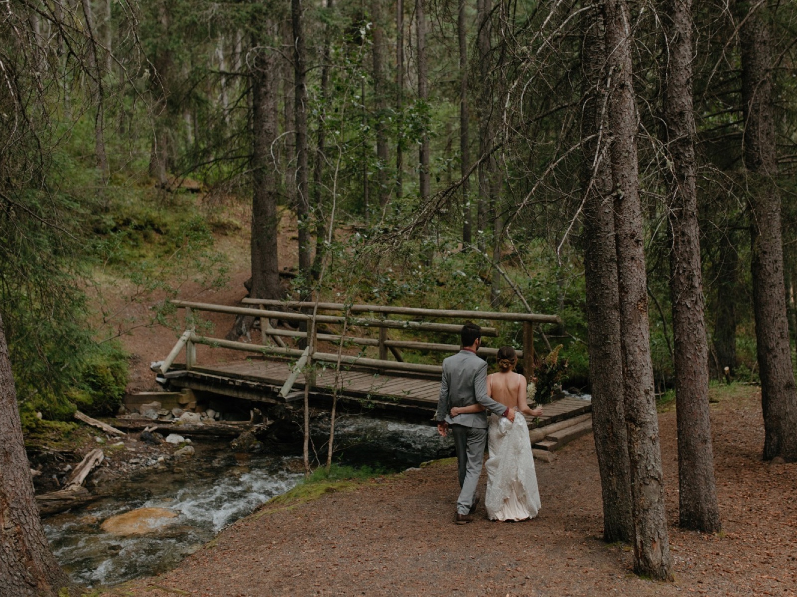 Couple leaving ceremony after an intimate standing ceremony in Sundance Canyon