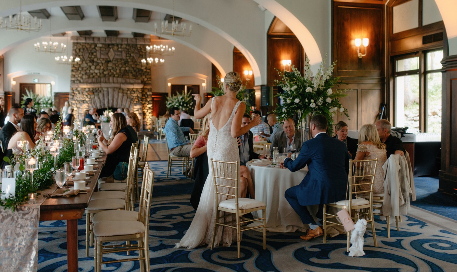 Victoria Ballroom reception inspiration with greenery centrepieces and gold chevalier chairs