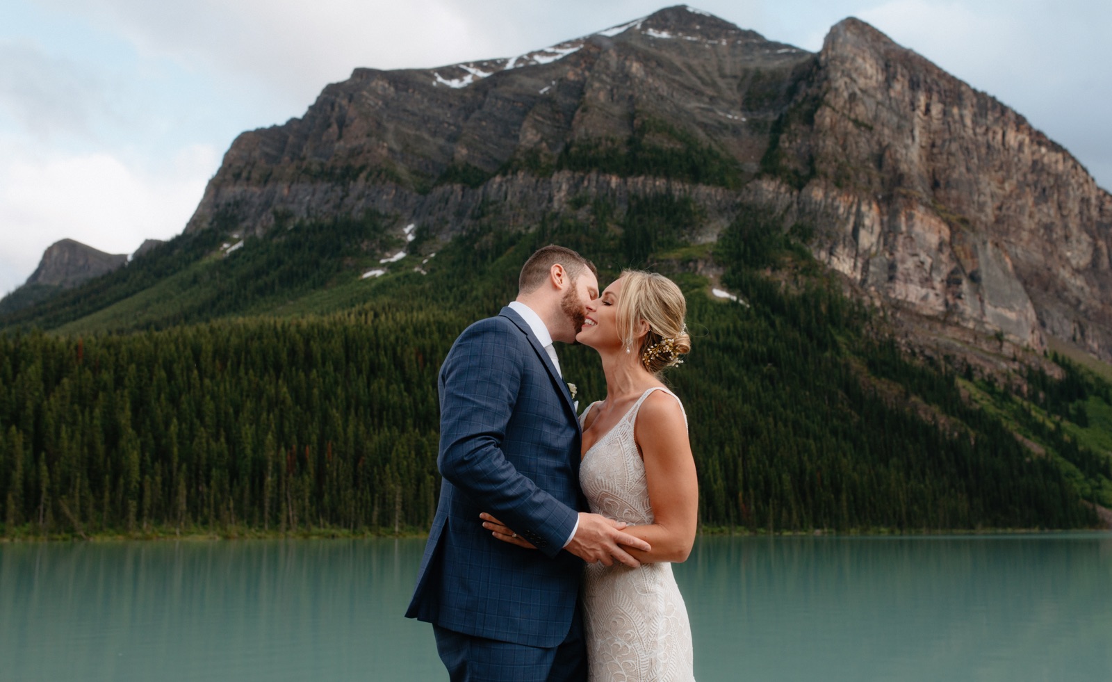 Wedding portraits at Lake Louise with Mt Fairview backdrop