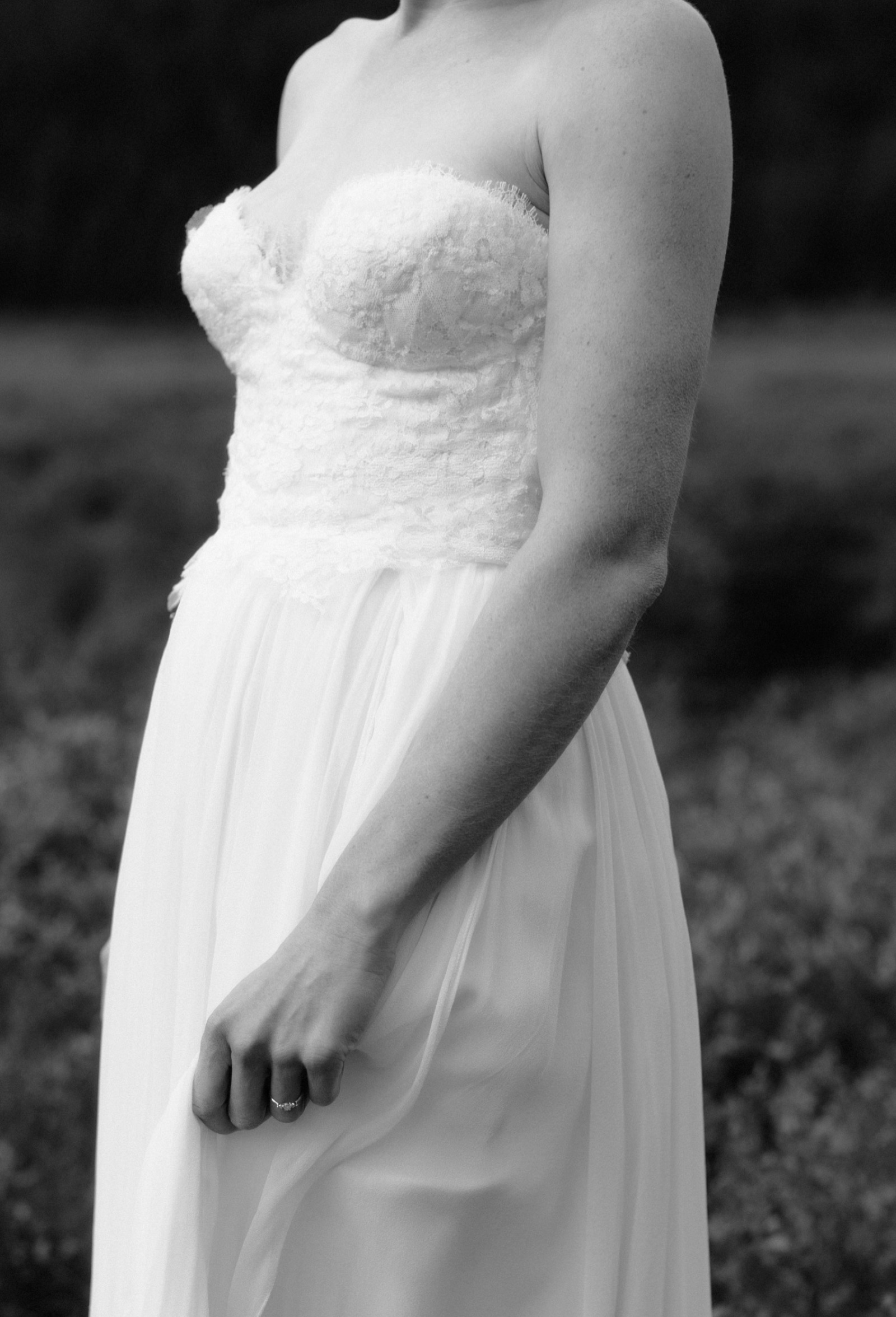 Delicate details of a flowy Sarah Seven wedding gown