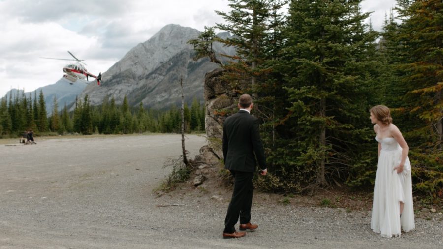 Elopement couple waiting at Mt Shark Helipad for their ride to Assiniboine Lodge
