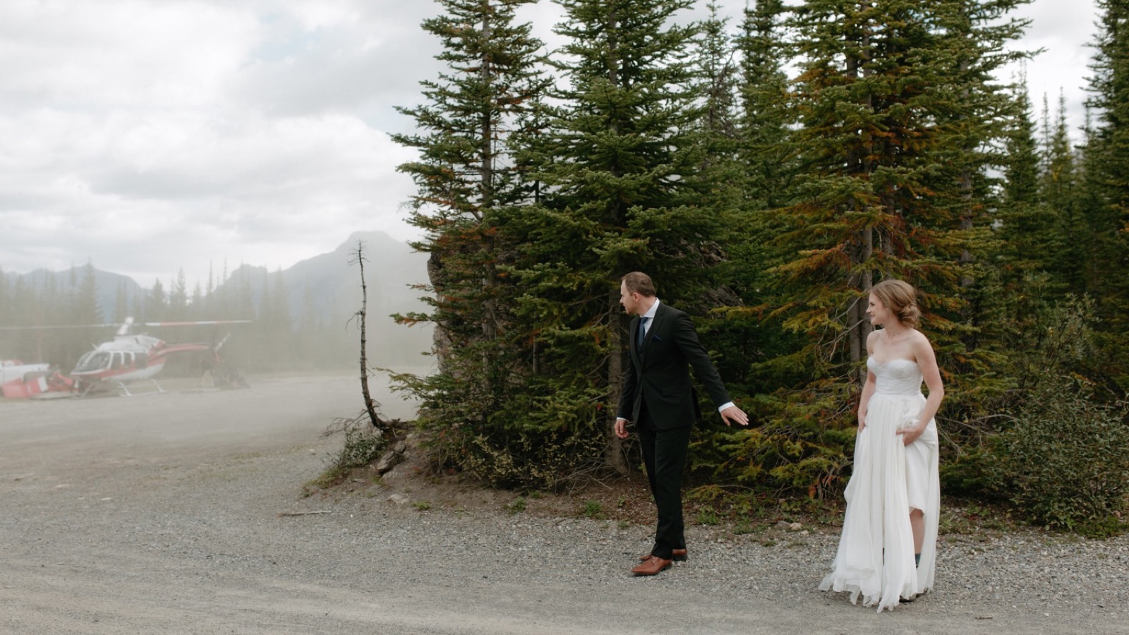 Wedding couple hiding from helicopter dust storm in Kananaskis