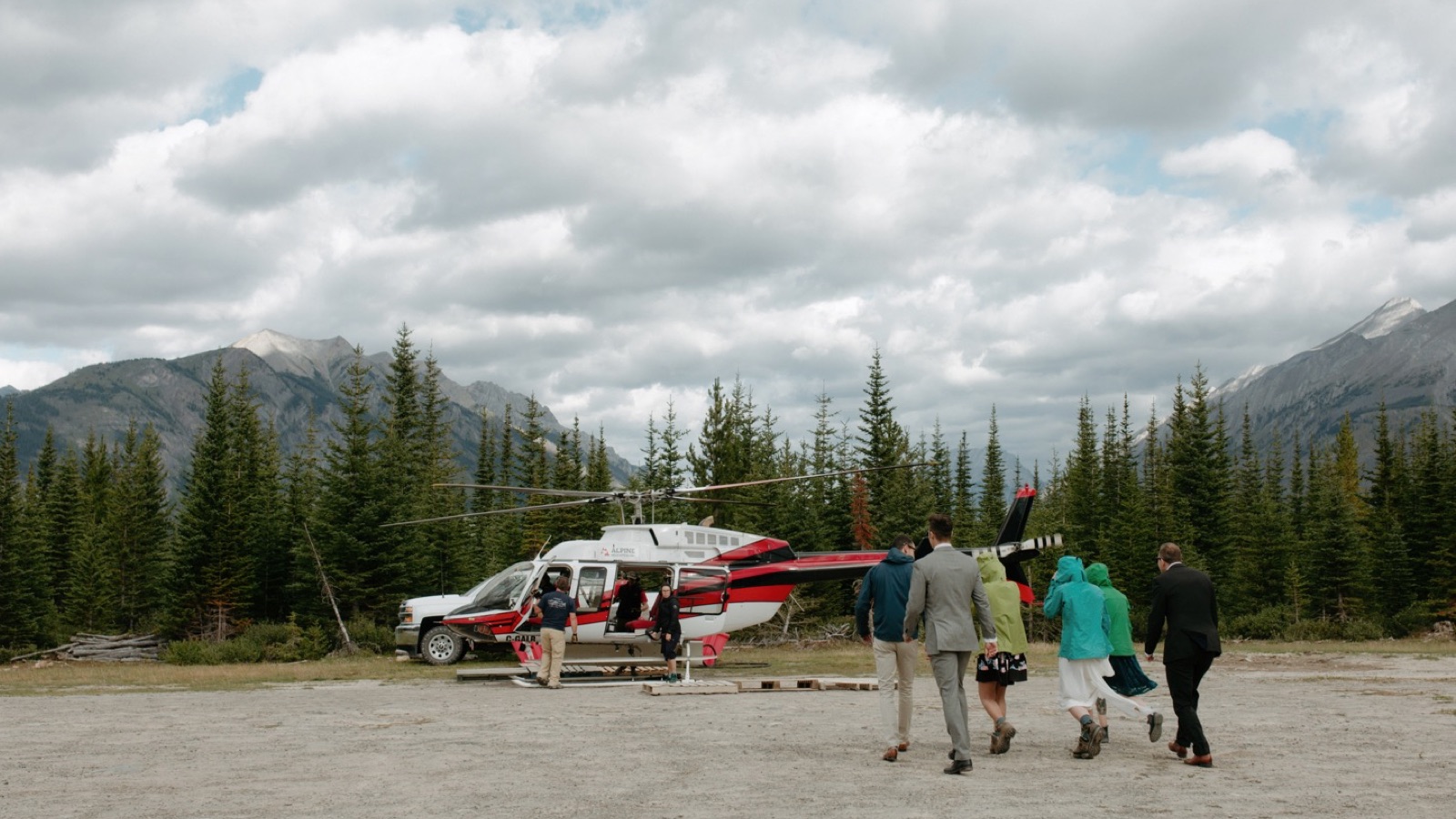 Wedding party leaving with helicopter to Assiniboine Lodge at Mt Shark Helipad