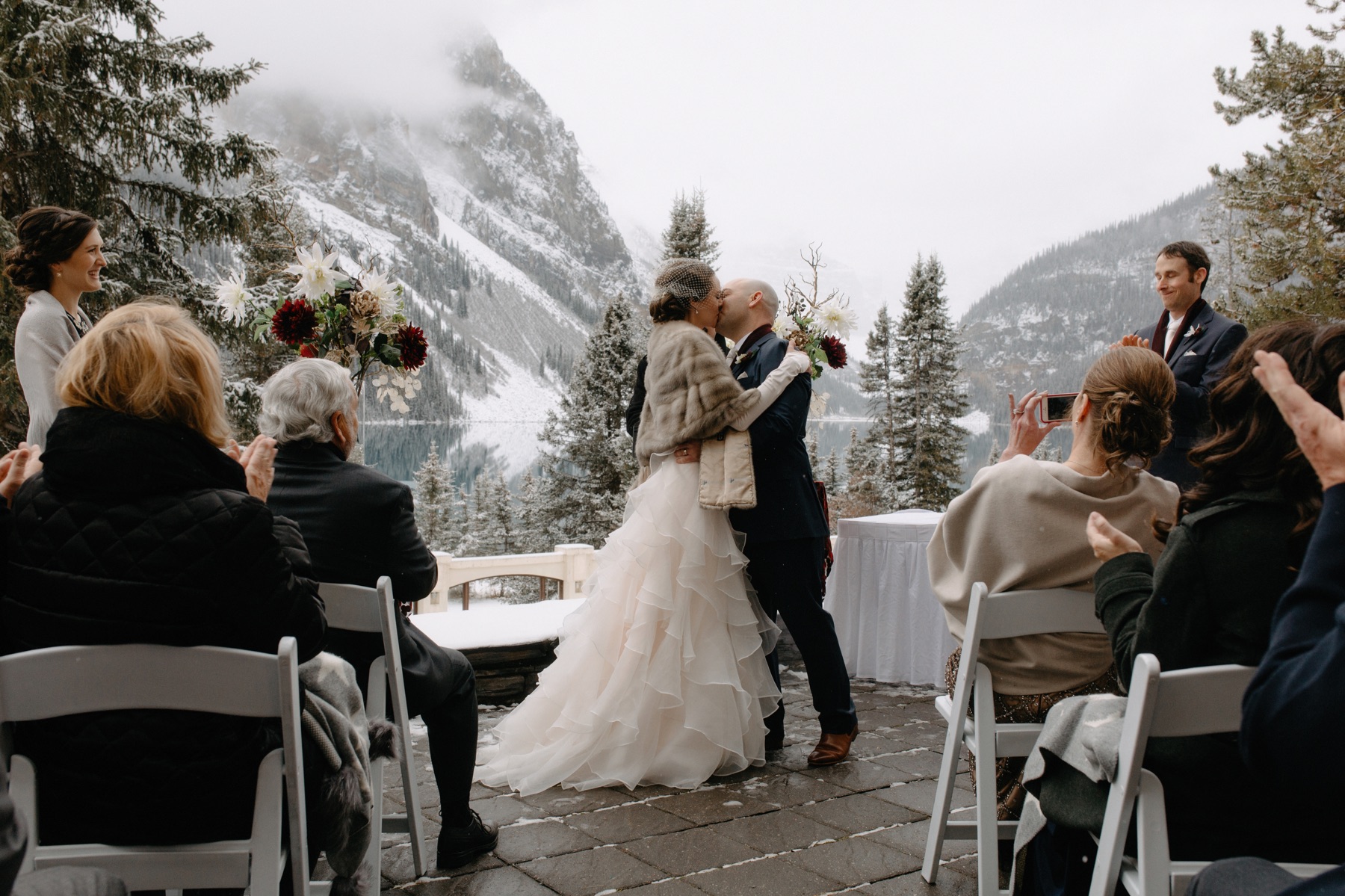 First kiss on the Victoria Terrace at Chateau Lake Louise in Banff National Park