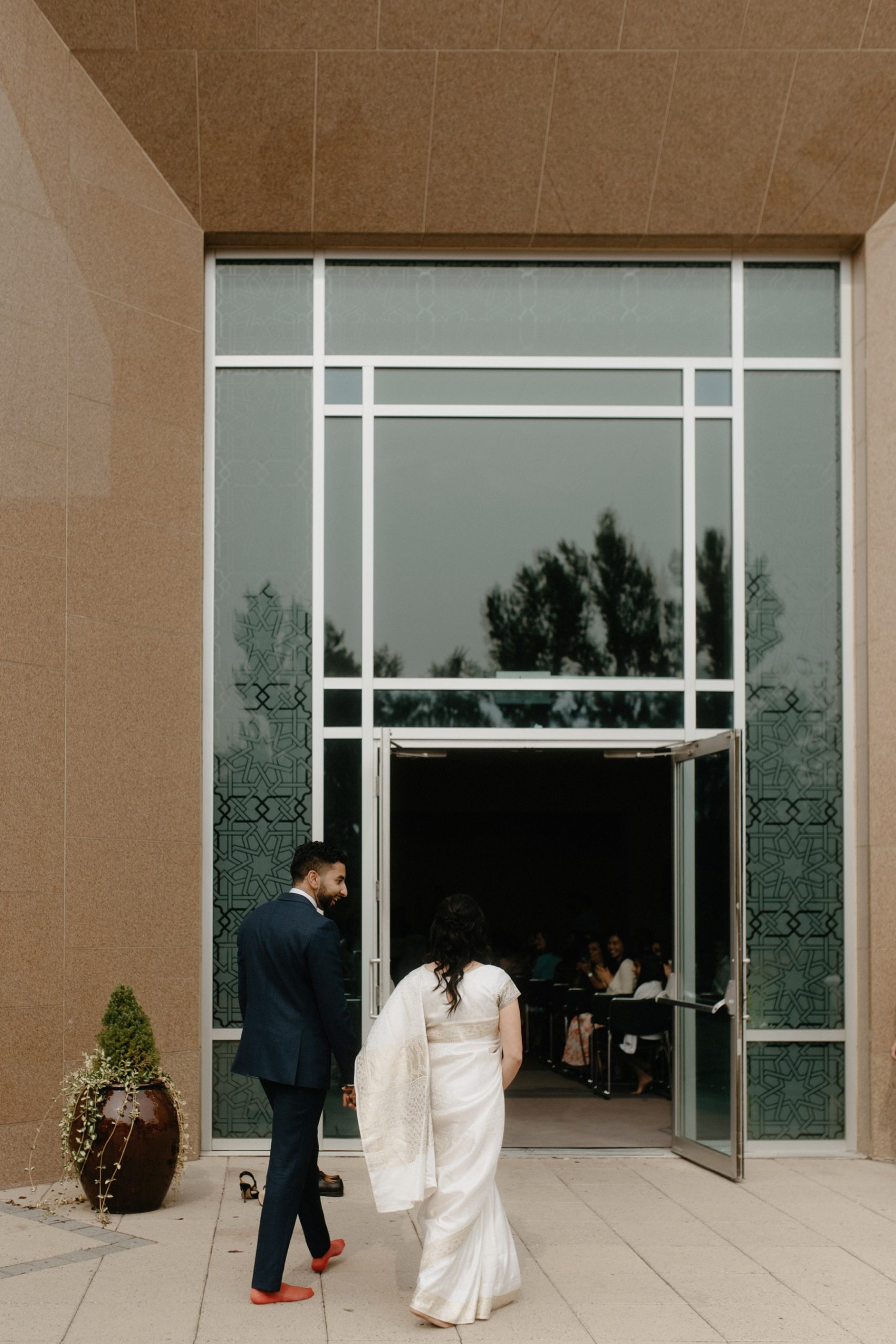 Couple entering their nikkah ceremony at Calgary Ismaili Jamatkhana