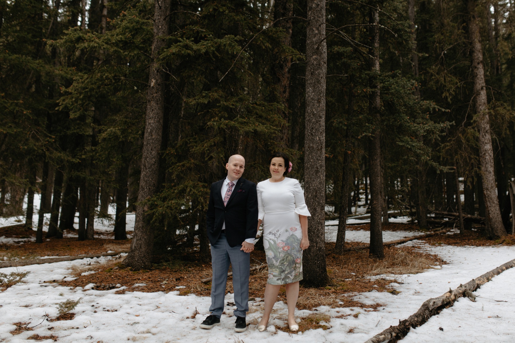 Banff forest wedding portraits with couple holding hands