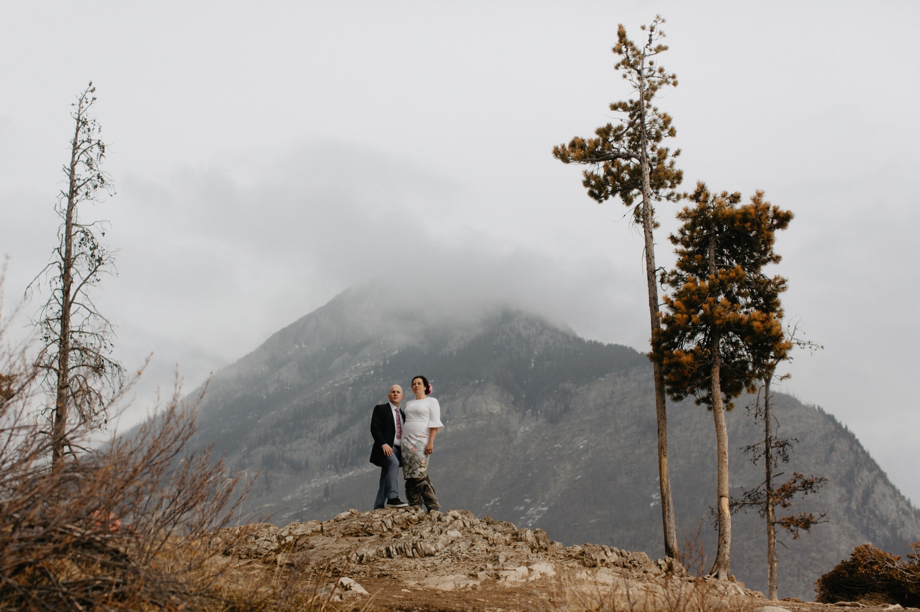 Midwinter elopement portraits at Lake Minnewanka in Banff National Park