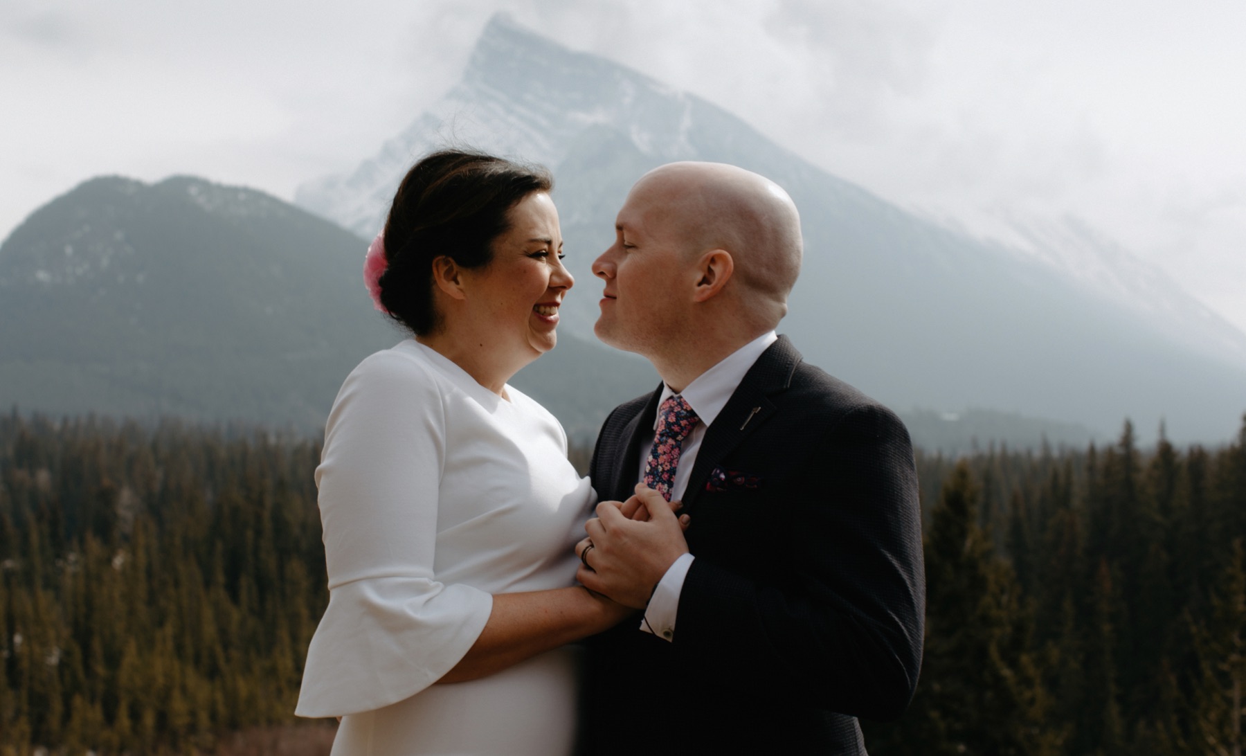 Newly married couple with Mount Rundle backdrop in Banff