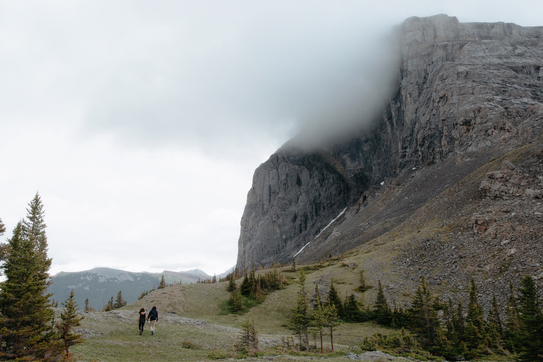 Couple hiking the morning of their wedding in Spray Lakes Provincial Park