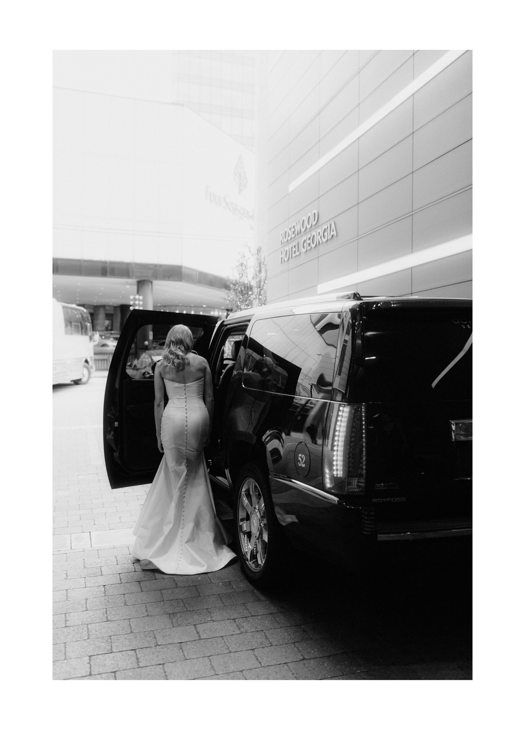 Bride entering her prviate car at the Rosewood Hotel Georgia in downtown Vancouver after getting ready