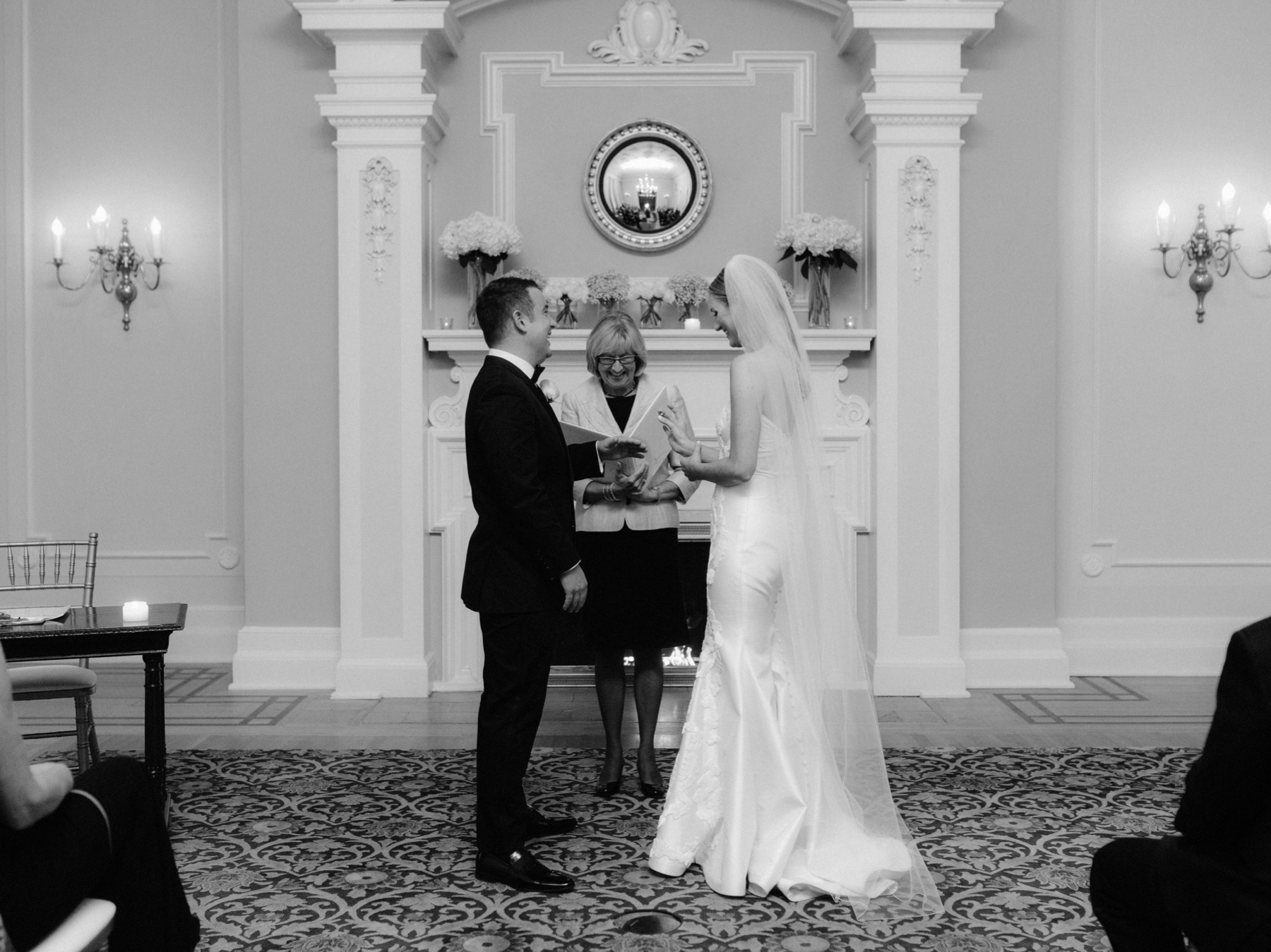 The ring exchange at an intimate classic black tie wedding at The Vancouver Club