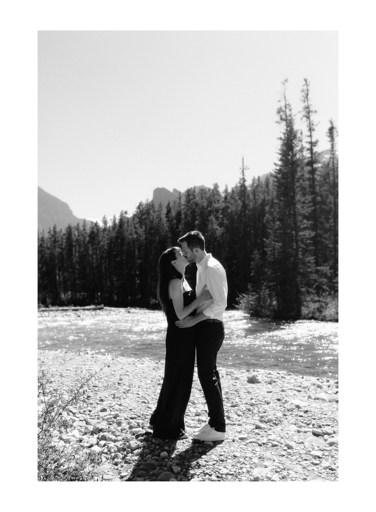 First kiss of a midday elopement in Lake Louise