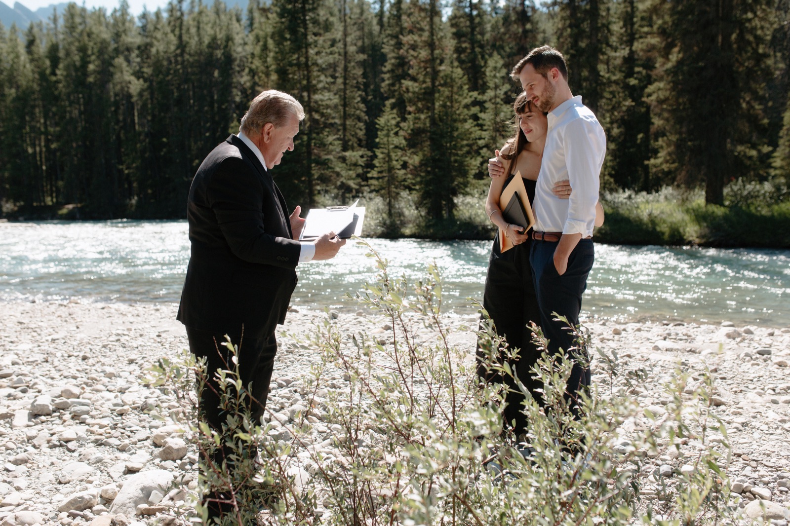 John Stutz officiating an informal elopement along the Bow River in Banff National Park