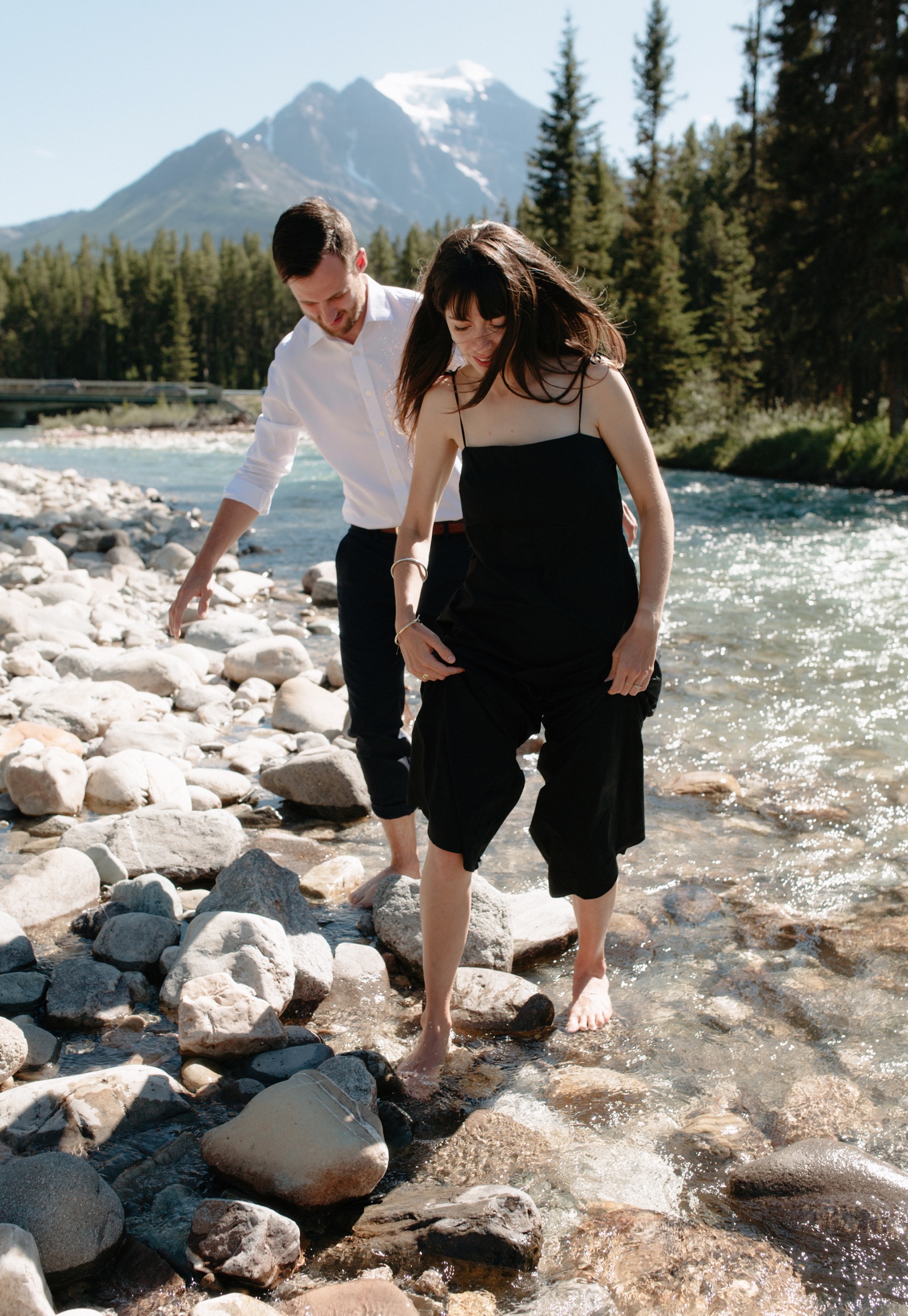 Barefoot elopement in the Bow River with Mount Temple backdrop