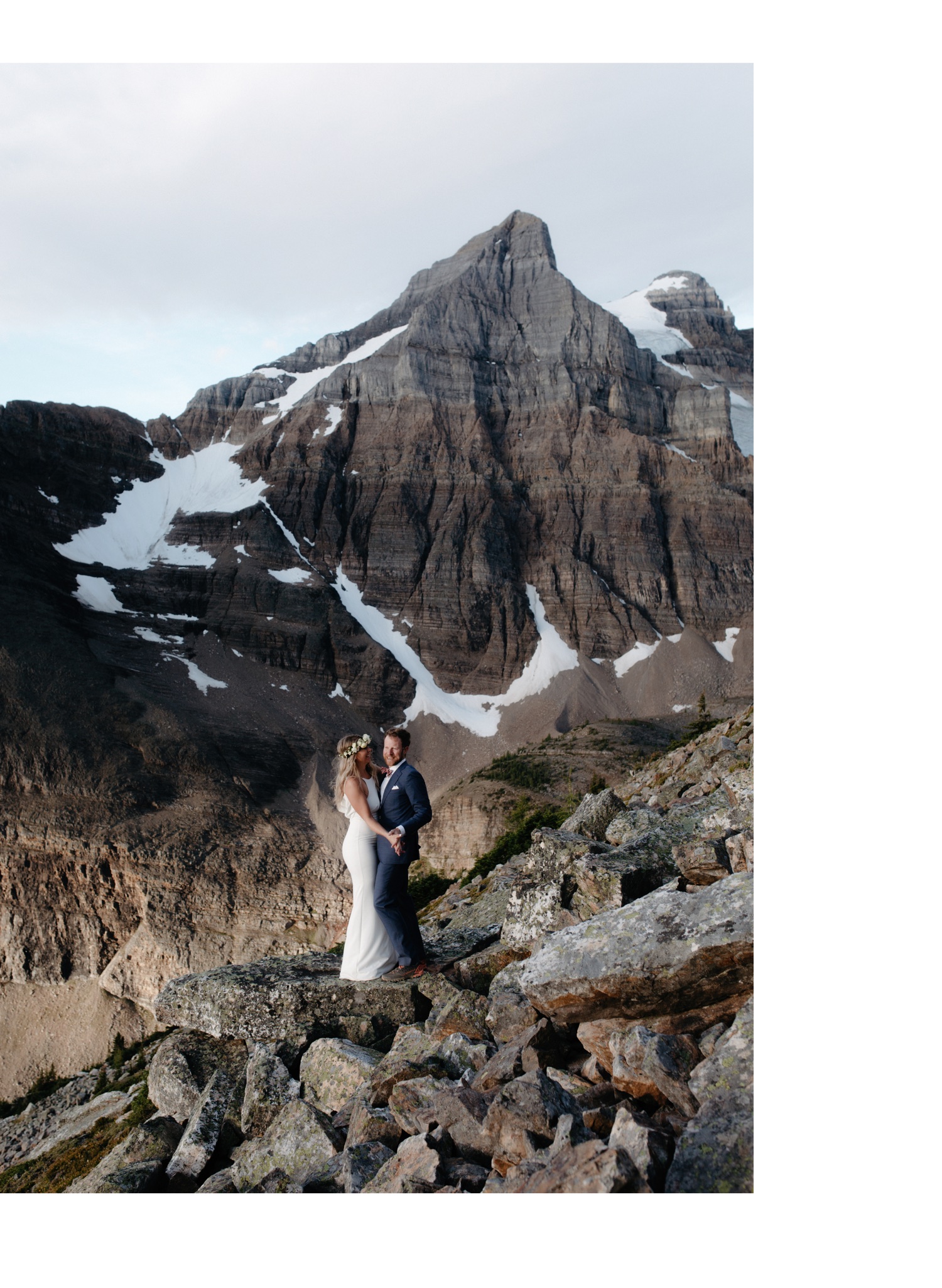 Elopement couple portraits with a banded mountain backdrop in the heart of Banff National Park