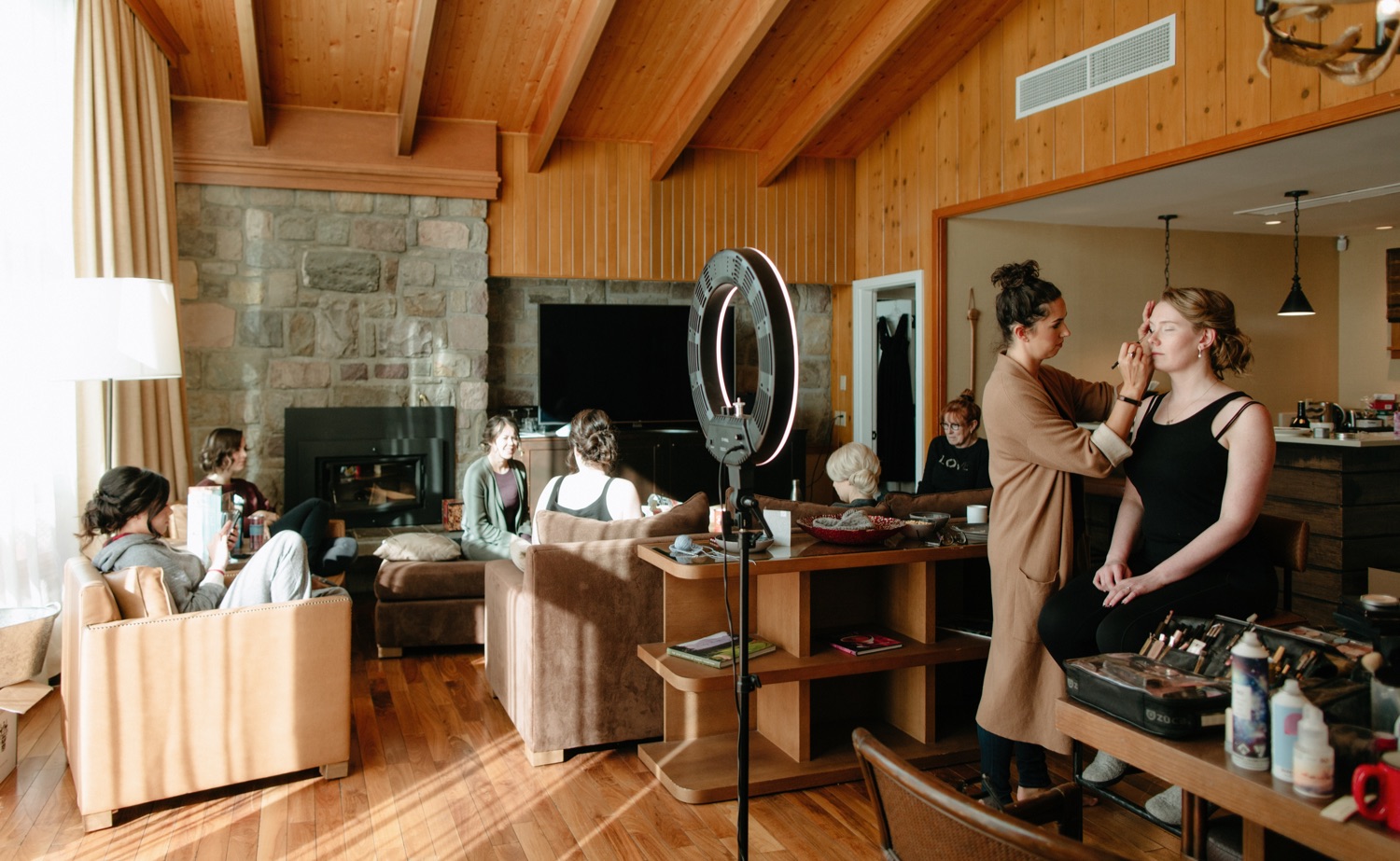 Bridal party getting ready in a Jasper Park Lodge Estate Cabin for a winter wedding