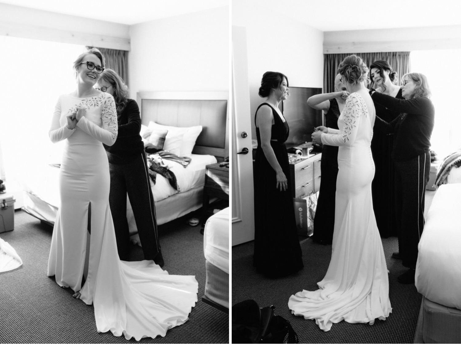 The bride clasping her hands and happily looking at her bridesmaids as her Pronovias dress is put on