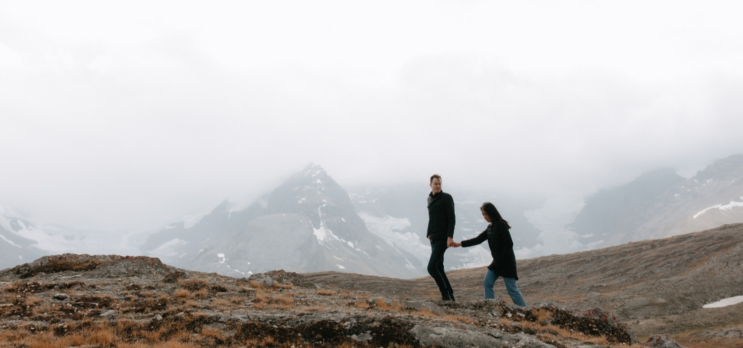 Engaged couple hiking the Icefields Parkway for photos