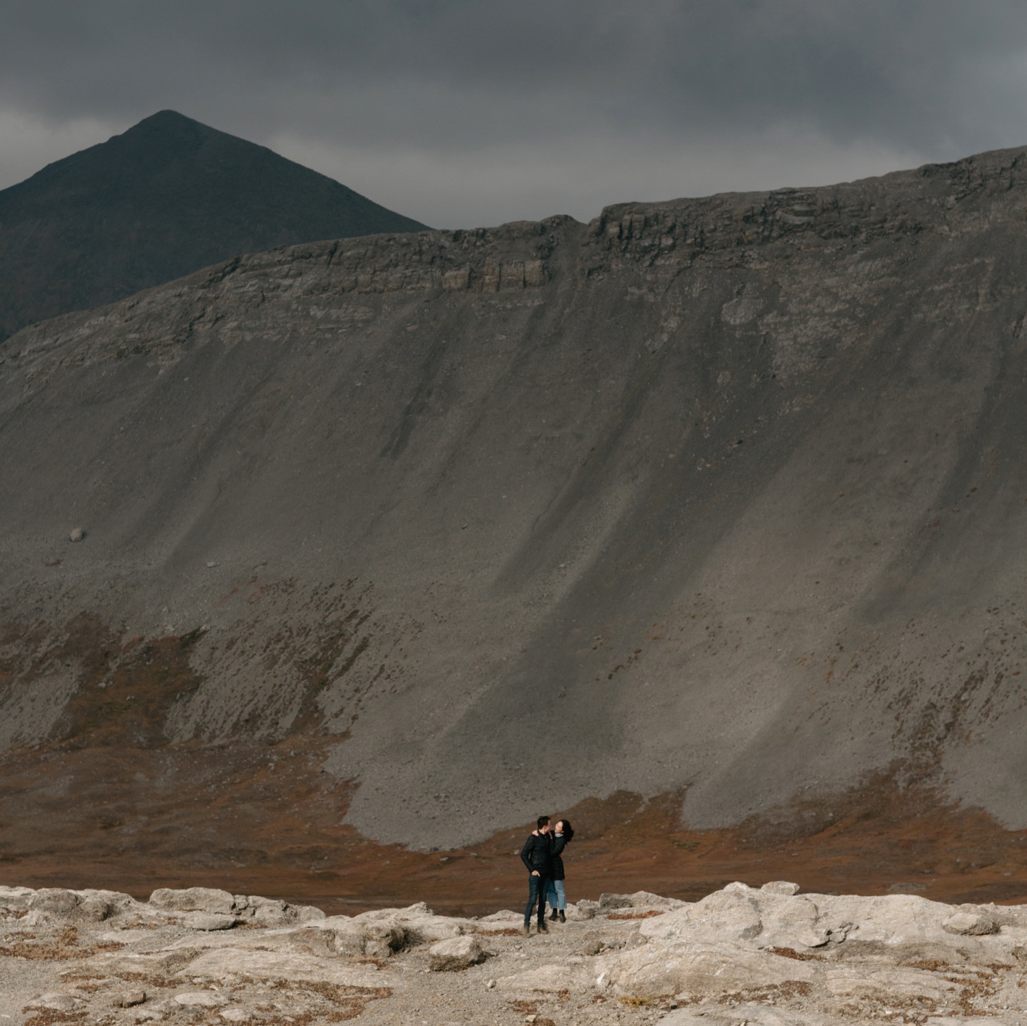 Meadows and glacier carved mountain peaks for a hiking engagement session in Canada
