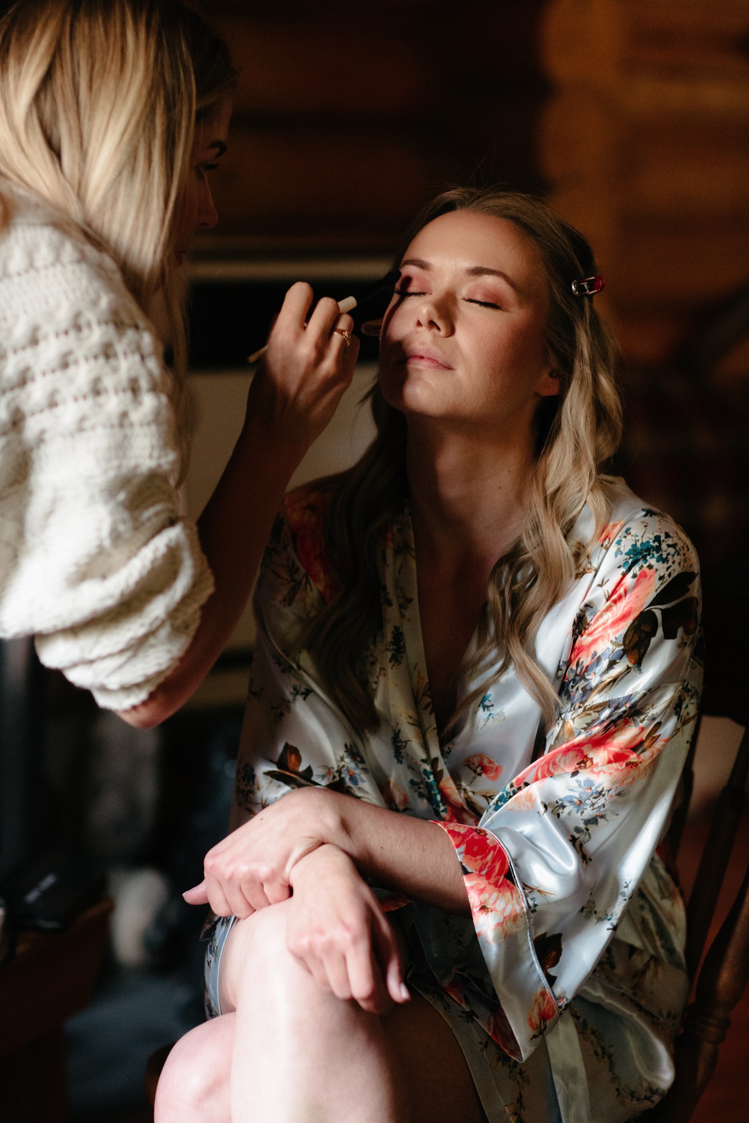 Simply Me Hair and Makeup at Cathedral Mountain Lodge doing final makeup touchups