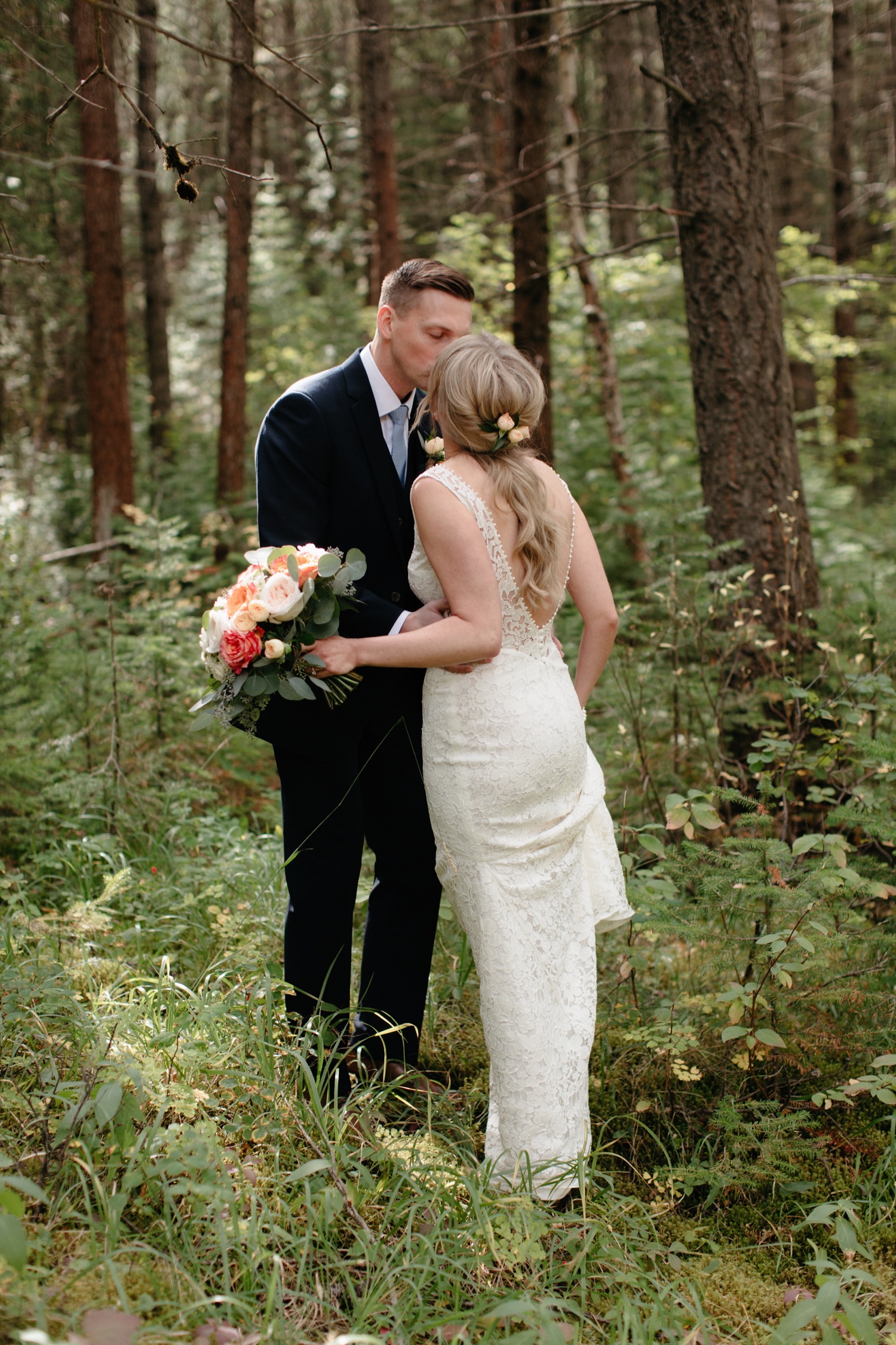 First look for an intimate wedding behind the cabins at Cathedral Mountain Lodge