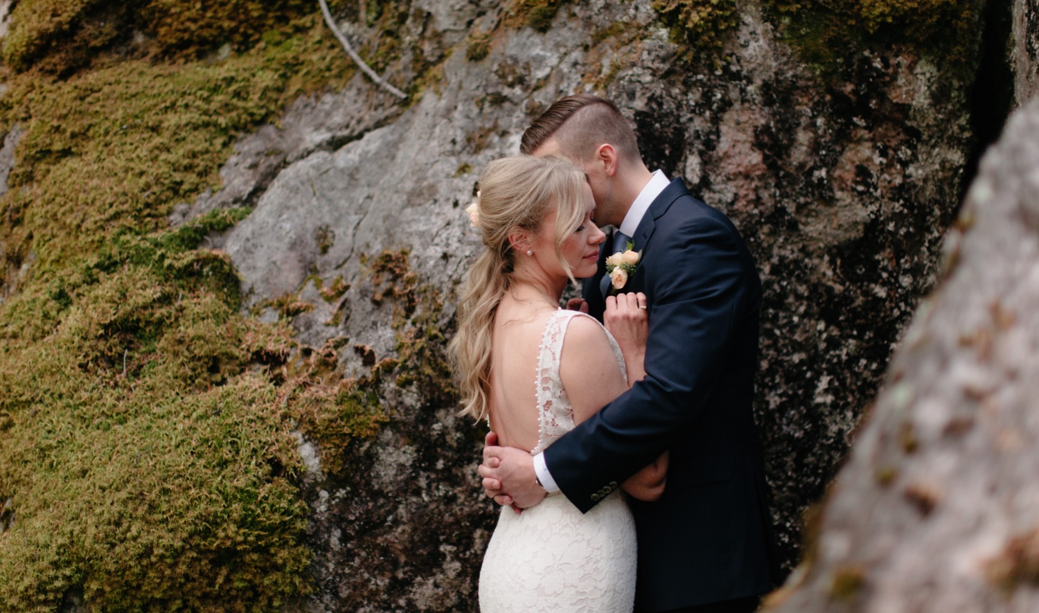 Moss covered rock and lichen backdrop for elopement portraits in the Canadian backcountry
