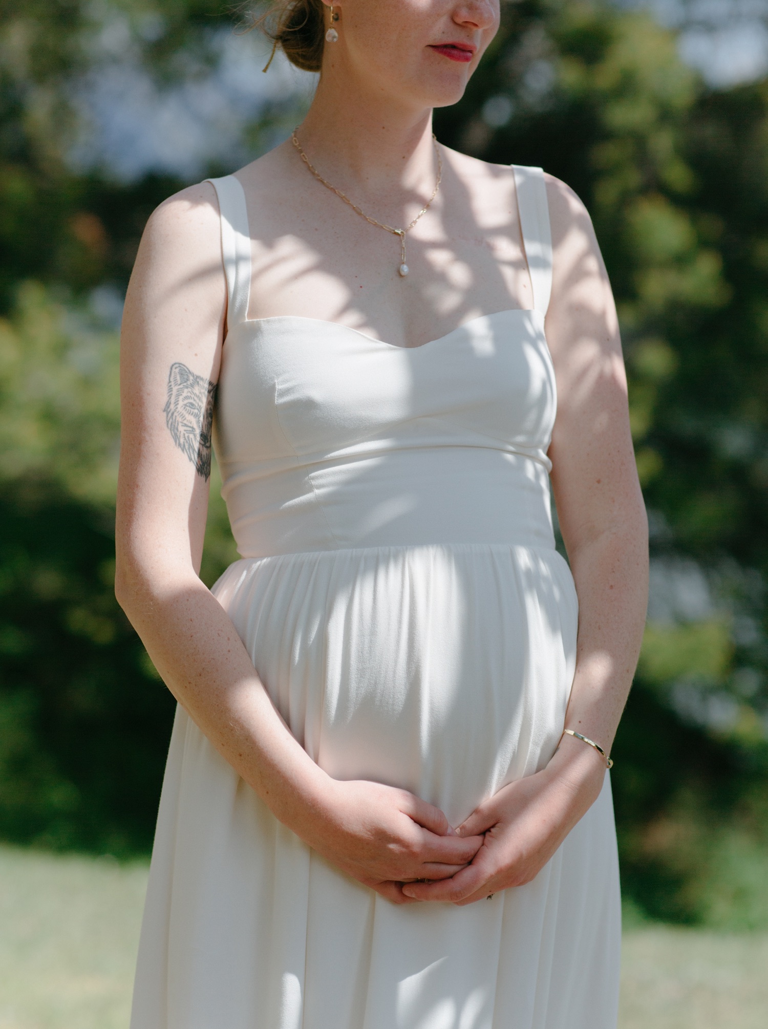 Maternity bridal in Banff with Reformation Dress and wolf tattoo