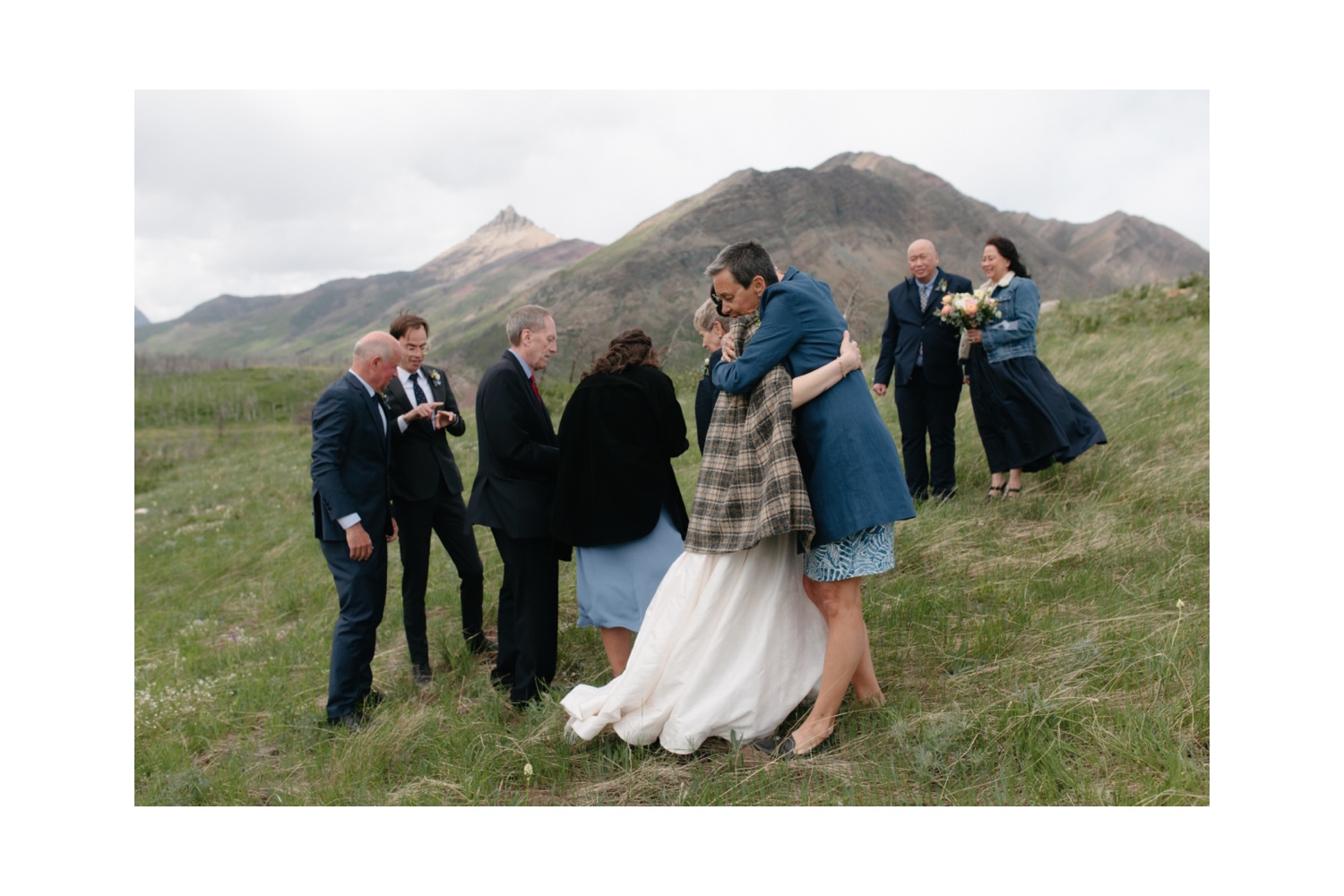 Family embracing after their Waterton elopement