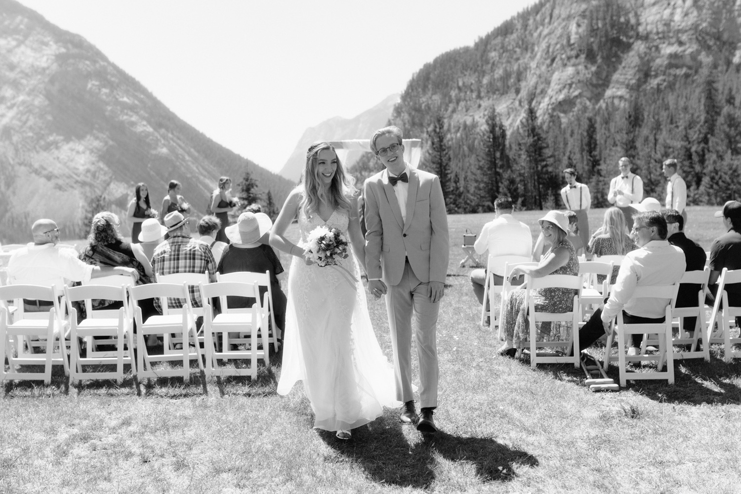 Tunnel Mountain Reservoir wedding recessional on a hot summer day in Banff