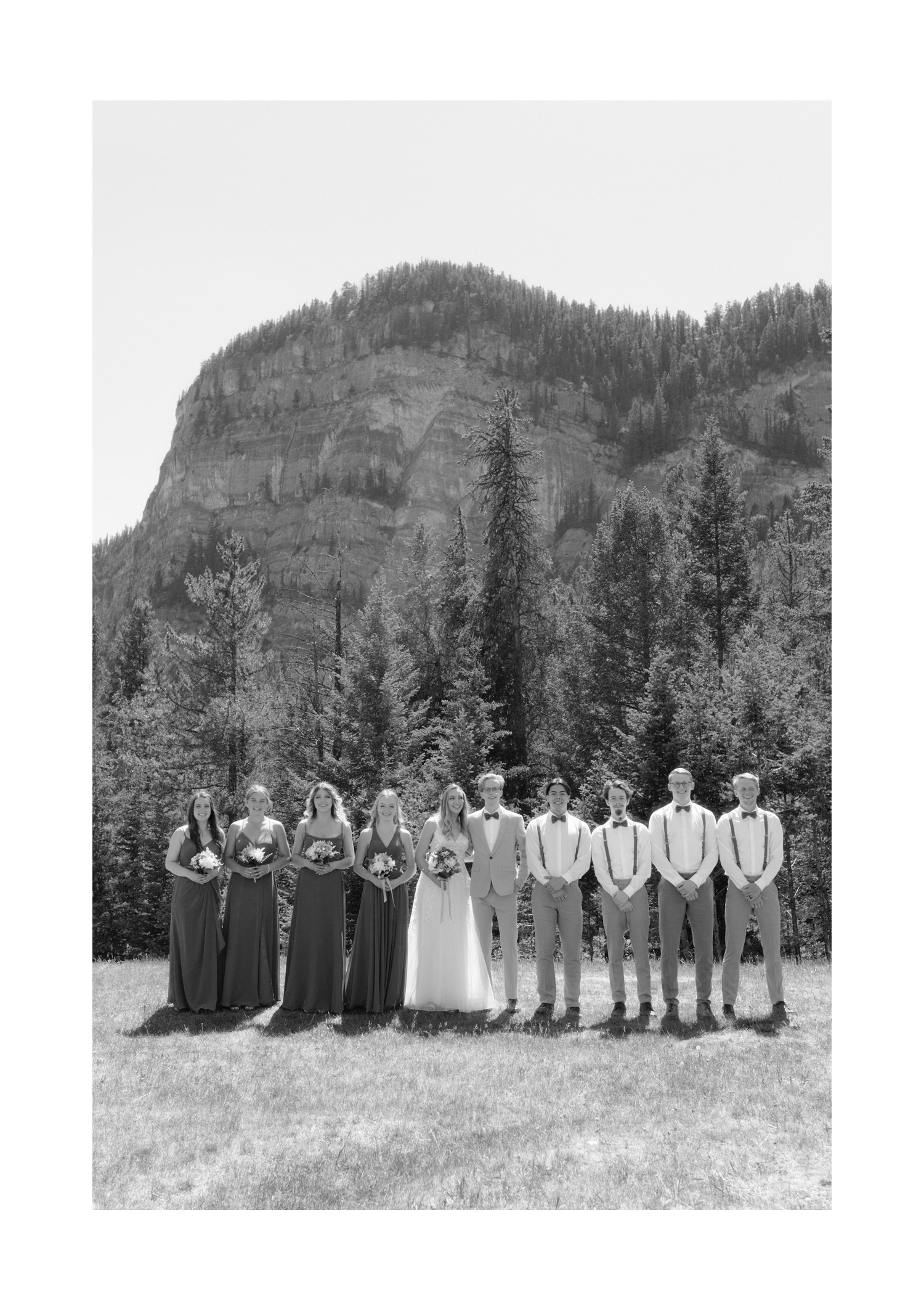 Bridal party photography after a Tunnel Mountain Reservoir wedding in front of Sleeping Buffalo